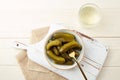 Marinated gherkins in a bowl and pickled juice or cucumber pickle Royalty Free Stock Photo