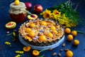 Homemade pie with apricots and almonds on a blue rustic background. Close up Royalty Free Stock Photo