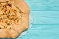 Homemade pie with chicken meat and mushrooms on a wooden board on green table background Royalty Free Stock Photo