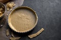 Homemade pie crust in pie plate. Cooking apple pie, dark background. Copy space Royalty Free Stock Photo