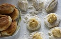 Homemade pie making. Ready, raw pies and filling on the dough. Royalty Free Stock Photo