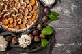 Homemade pie with plums on the table on a white stone background Royalty Free Stock Photo