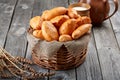 Homemade pies from the oven lie on in the basket. Traditional bakery products.