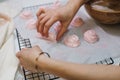 Homemade pink marshmallows on baking paper background on the kitchen