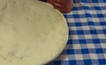 Homemade pizza dough on blue towel background Royalty Free Stock Photo