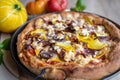 Homemade pizza with feta cheese, salami, yellow squash, onions and tomatoes Royalty Free Stock Photo