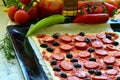 Homemade pizza with fresh tomatoes, peppers, olives, mushroom and cheese Royalty Free Stock Photo