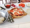 homemade pizza on the kitchen counter Royalty Free Stock Photo