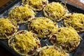 Homemade pizza preparation for the whole family, small beautiful cheese pizzas