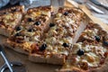 Homemade pizza with tuna, cheese, onions, olives and tomatoes Royalty Free Stock Photo