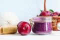 Homemade plum face and body scrub/foot soak/bath salt in a glass jar. DIY cosmetics and spa.