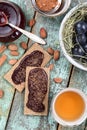 Homemade plum jam in glass jar and on rye crackers served with r Royalty Free Stock Photo