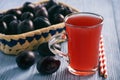 Homemade plum kissel on wooden table. Royalty Free Stock Photo