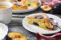 Homemade plum pie and cup of coffee. New York Times recipe plum cake Royalty Free Stock Photo