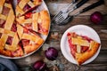 Homemade plum pie on rustic background Royalty Free Stock Photo