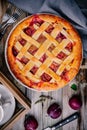 Homemade plum pie on rustic background Royalty Free Stock Photo