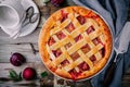 Homemade plum pie on rustic background Royalty Free Stock Photo