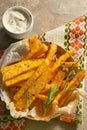 Homemade polenta fries with thyme, rosemary and yogurt