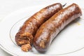 Homemade Pork Meat Sausages served on the plate Royalty Free Stock Photo