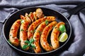 Homemade pork sausage links on a wooden background