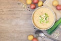 Homemade potato and leek soup, top view table scene on light wood with copy space Royalty Free Stock Photo