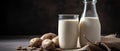 Homemade potato milk in a glass on a dark wooden background.