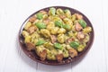 Homemade potatoes gnocchi with basil , cheese and mushrooms