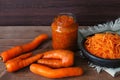 Homemade prepared one fermented vegetable glass jar with whole nonstandard ugly carrot vegetables and chopped slices