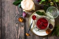 Homemade preservation. Delicious plum jam on a rustic wooden table. Top view flat lay background. Royalty Free Stock Photo