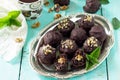 Prune balls in chocolate with hazelnut filling