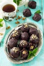 Prune balls in chocolate with hazelnut filling