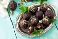 Prune balls in chocolate with hazelnut filling. Copy space