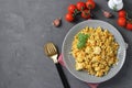 Homemade ptitim pasta with chicken and vegetables on dark gray table. View from above. Copy space.