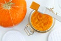 Homemade pumpkin face mask in a glass jar. DIY cosmetics and spa. Top view, copy space. Royalty Free Stock Photo