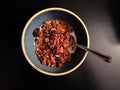 Homemade pumpkin granola with milk and spoon on dark background Royalty Free Stock Photo