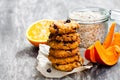 Homemade pumpkin and orange cookies on rustic wooden background Royalty Free Stock Photo