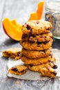 Homemade pumpkin and orange cookies on rustic wooden background Royalty Free Stock Photo