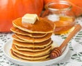 Homemade pumpkin pancakes with butter and honey Royalty Free Stock Photo