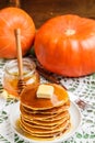 Homemade pumpkin pancakes with butter and honey Royalty Free Stock Photo