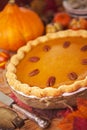 Homemade pumpkin pie on a rustic table Royalty Free Stock Photo