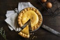 Homemade pumpkin pie with a slice cut out Royalty Free Stock Photo