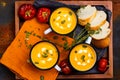 Homemade pumpkin soup in retro enamel mugs Royalty Free Stock Photo