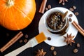 Homemade pumpkin spice facial mask/scrub made with ripe pumpkin puree, sugar and honey, cinnamon powder and ground coffee. Royalty Free Stock Photo