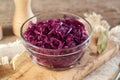 Purple fermented cabbage or sauerkraut in a transparent glass bowl Royalty Free Stock Photo