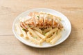 Quadrotto penne pasta white creamy sauce with grilled chicken Royalty Free Stock Photo