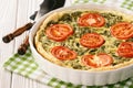 Homemade quiche with spinach, feta cheese and tomatoes. Royalty Free Stock Photo