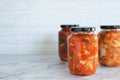 Homemade radish kimchi in a glass jar