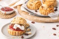 Homemade raisin scones with clotted cream and strawberry jam ready to eat Royalty Free Stock Photo