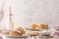 Homemade raisin scones with clotted cream and strawberry jam ready to eat Royalty Free Stock Photo