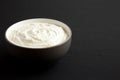 Homemade Ranch Dressing in a Bowl on a black background, side view. Space for text Royalty Free Stock Photo